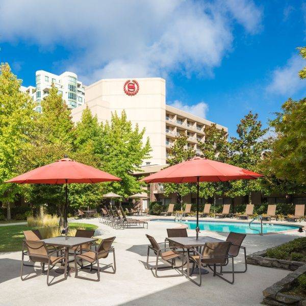 large patio and heated outdoor swimming pool in Richmond hotel