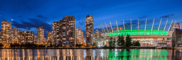 vibrant city lights & scenic view of Rogers Arena in Vancouver at night. Iconic venue for sport events & concert